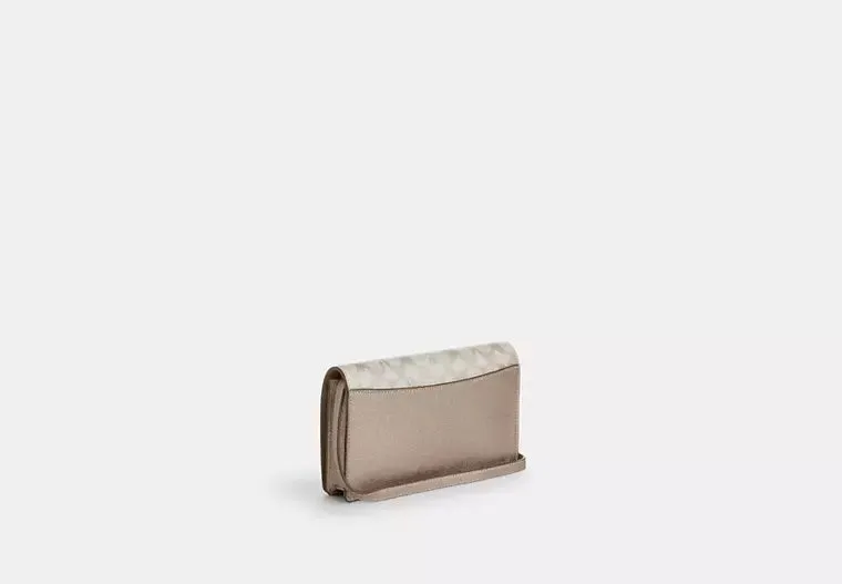 Anna Foldover Clutch Crossbody Bag In Signature Canvas Champagne Coach