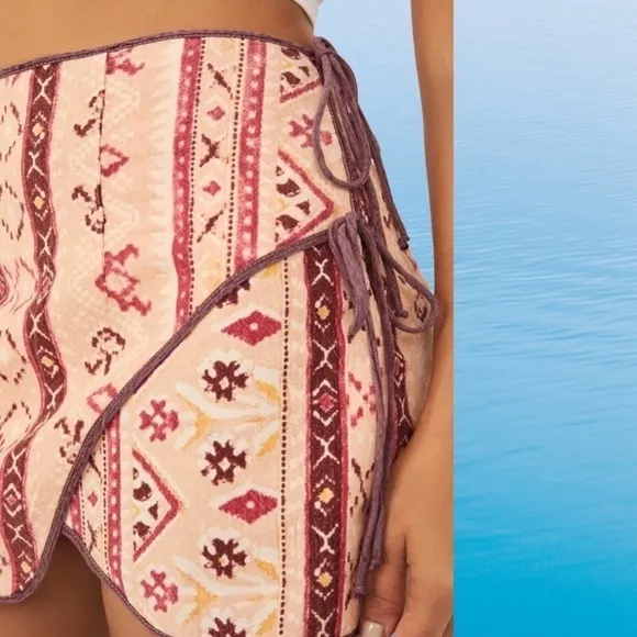 FREE PEOPLE Cleo Printed Side Slit Tie Wrap Mini Skirt in Multi Combo.