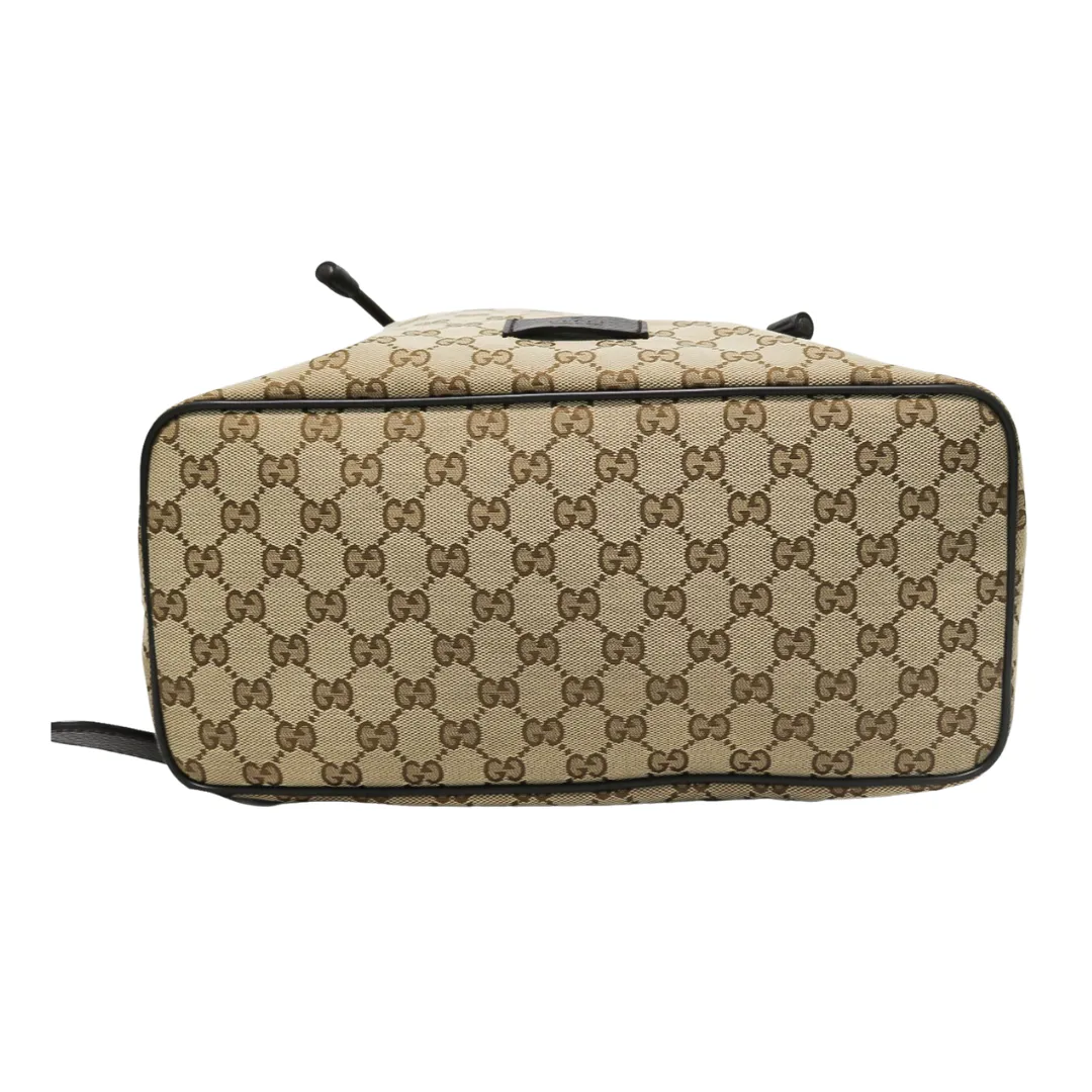 GUCCI MONOGRAM DRAWSTRING BACKPACK