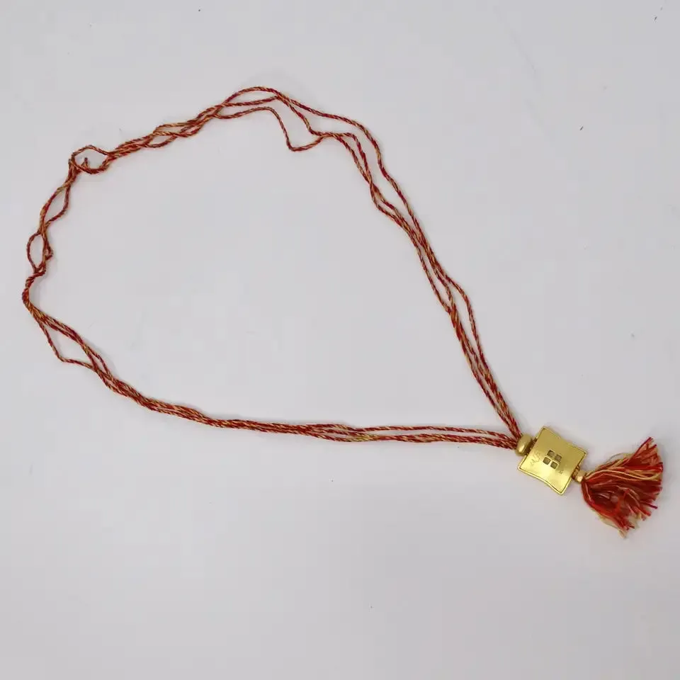 Hermes Gold Tone Pendent on Silk Yarn Chord Necklace