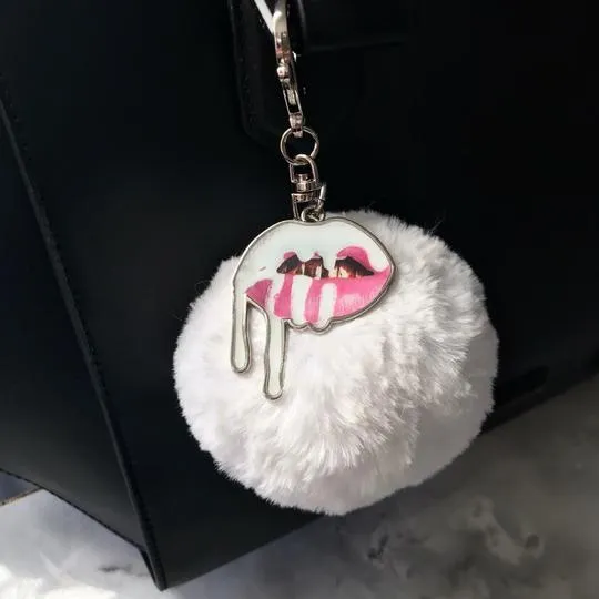 Kylie white puff ball keychain